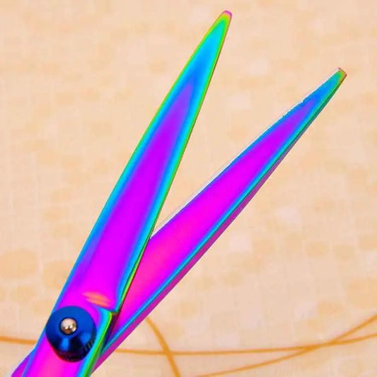 Iridescent rainbow stainless steel pet grooming scissors set closeup showing open precision blades