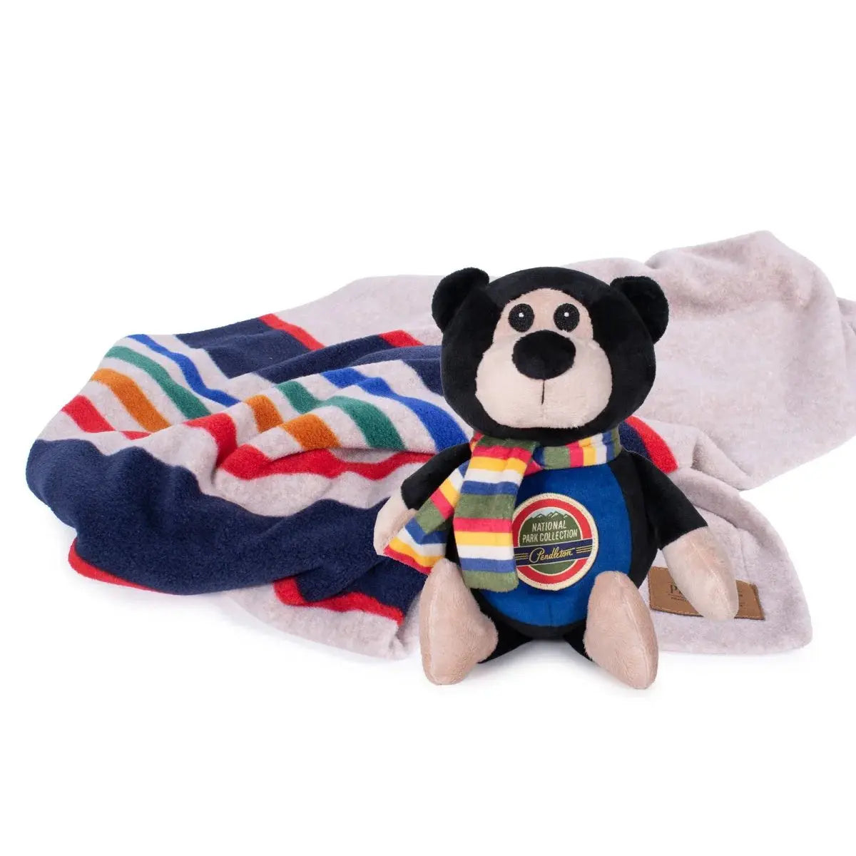 Pendleton National Park pet blanket with a cute bear plush toy for dogs and pets