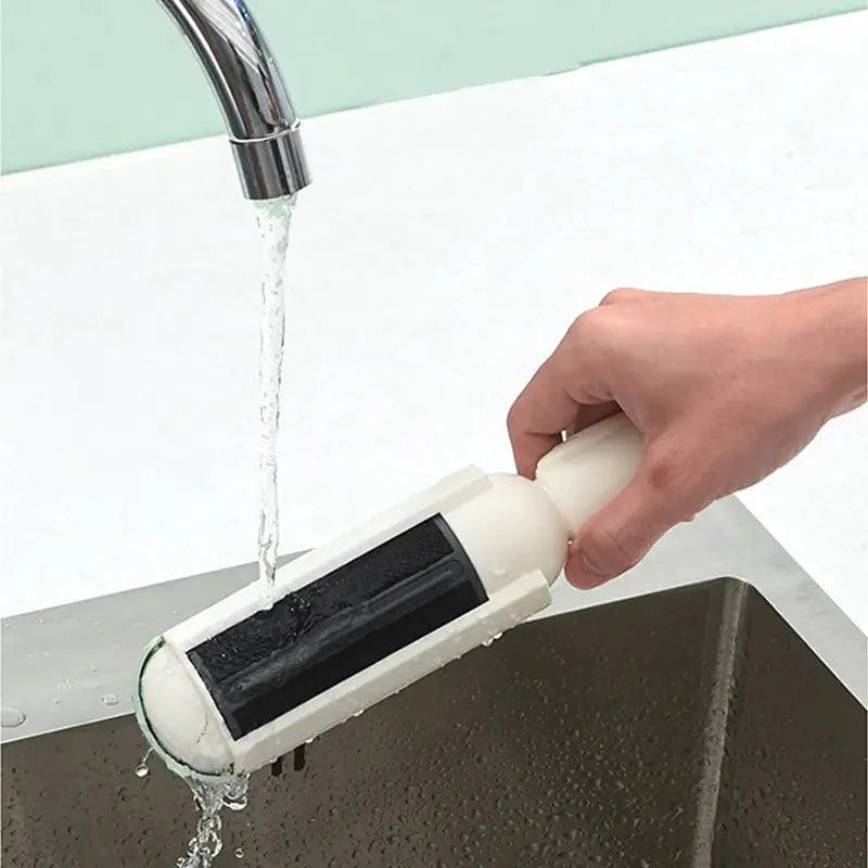 MANDOTOS Pet Hair Vacuum Being Rinsed Under Water, an Effective Pet Hair Removal Tool for Couches