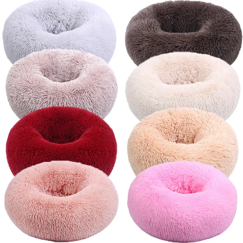 Cozy round dog beds in various colors, ideal as a plush cat bed for cold weather.