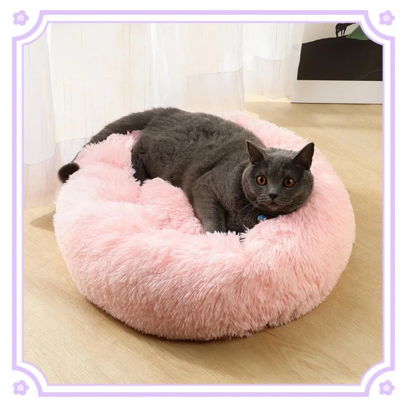 Soft and cozy pink plush cat bed for cold weather, perfect for keeping pets warm and comfortable