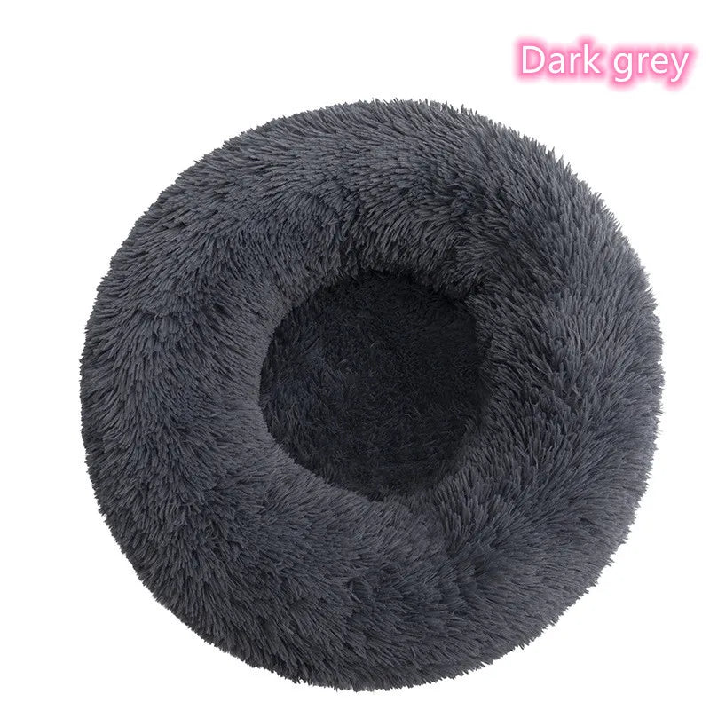 Dark grey round dog bed from Tail Chasers, a plush dog bed for anxiety with a cozy design