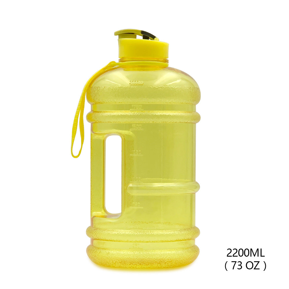 Bright yellow portable hydration jug for workouts with 2200ml capacity and easy-grip handle