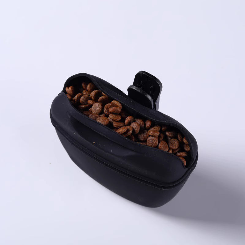 Portable pet treat pouch in black filled with dog treats for training and convenience