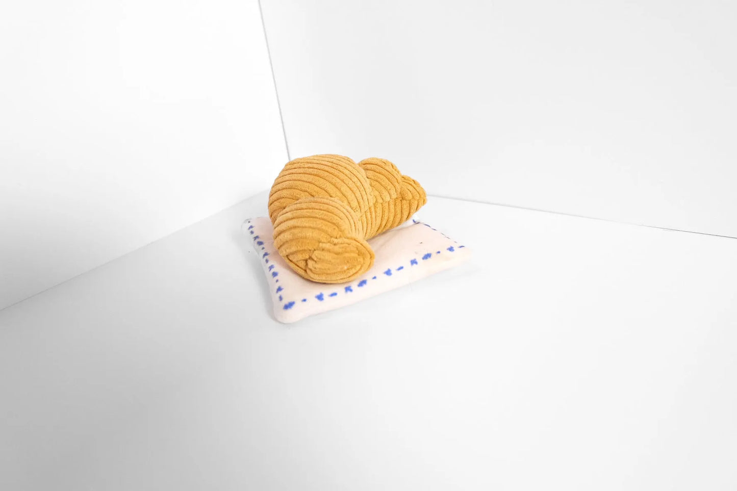 Premium Croissant Snuffle Toy for Dogs by Come Here Buddy, a budget-friendly dog toy in a soft, textured design, perfect f...