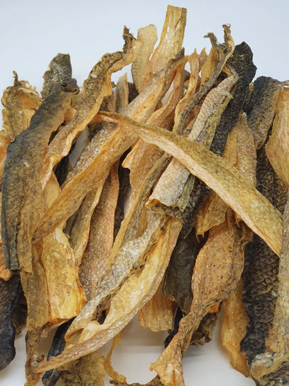 Purrfect Pet Kingdom Advanced Tickled Pet Salmon Skins Flat Dog Treats by The Family Pet, 6oz pack, ideal for small animals.