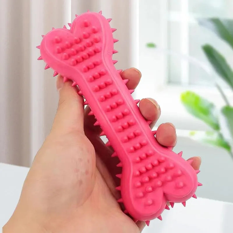 Bright pink Rubber Bone Dog Chew Toy with textured spikes for enhanced grip and fun chewing