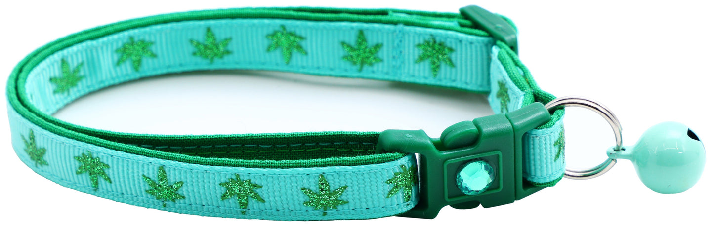 Turquoise Tail Chasers safe adjustable cat collar for pets with a leaf pattern and a jingle bell