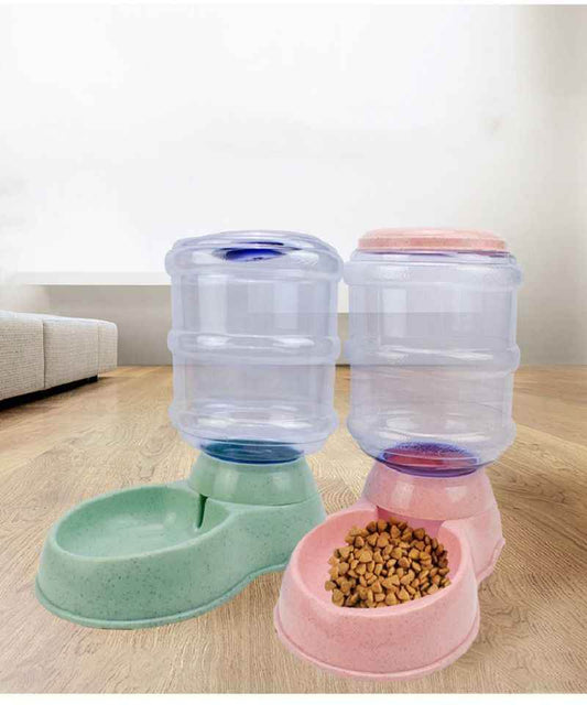 Purrfect Pet Kingdom self-dispensing pet waterer and feeder combo in green and pink with clear water containers