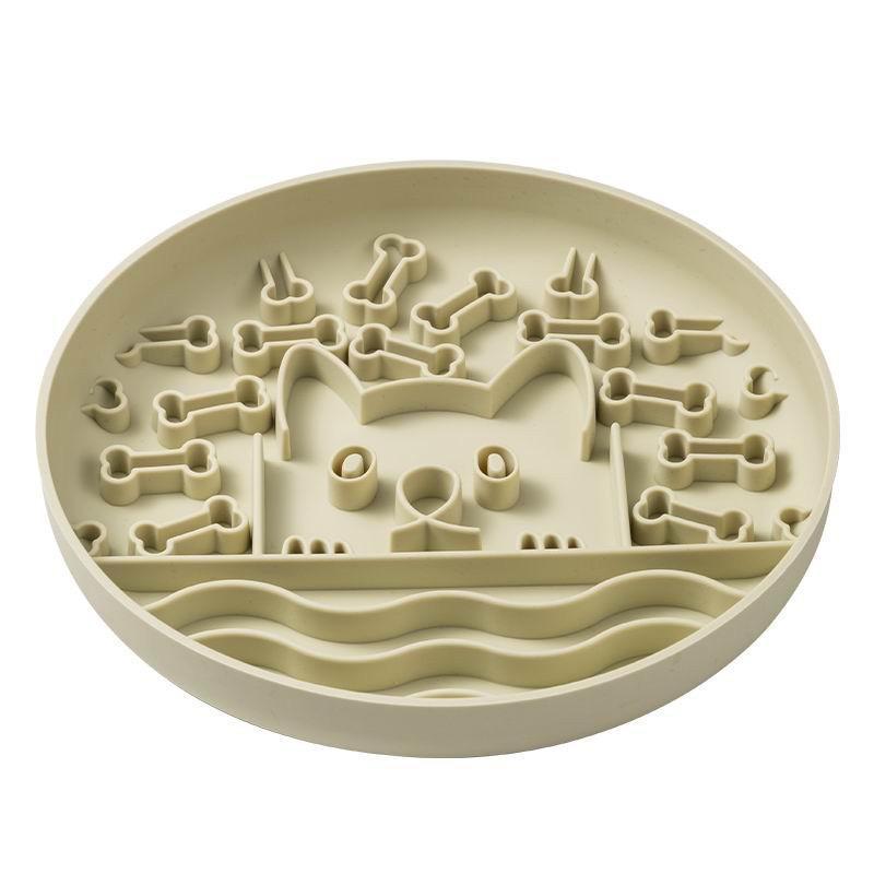 Silicone slow feeder for dogs in a round shape featuring fun bone patterns for engaging mealtime activity