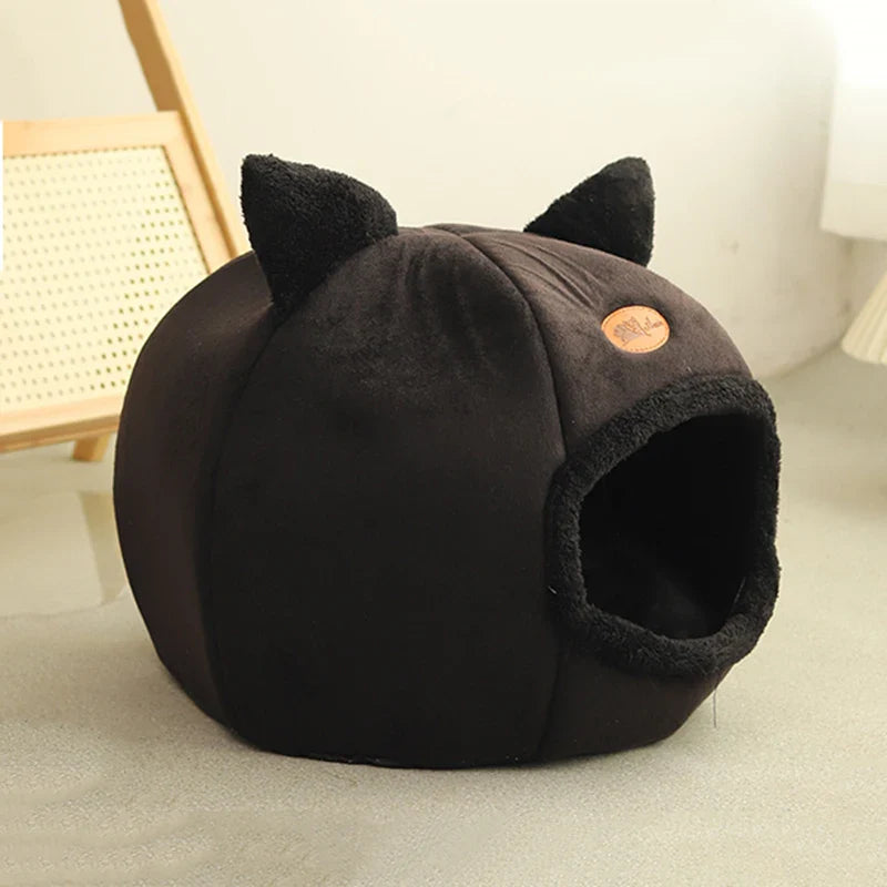 Cozy black cat cave from Purrfect Pet Kingdom, a soft cat bed for cold weather with cute ears