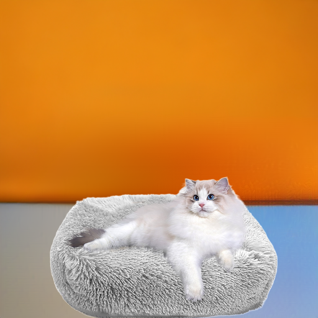 Gray soft cozy cat bed with a cat lounging comfortably on it for a relaxing pet experience