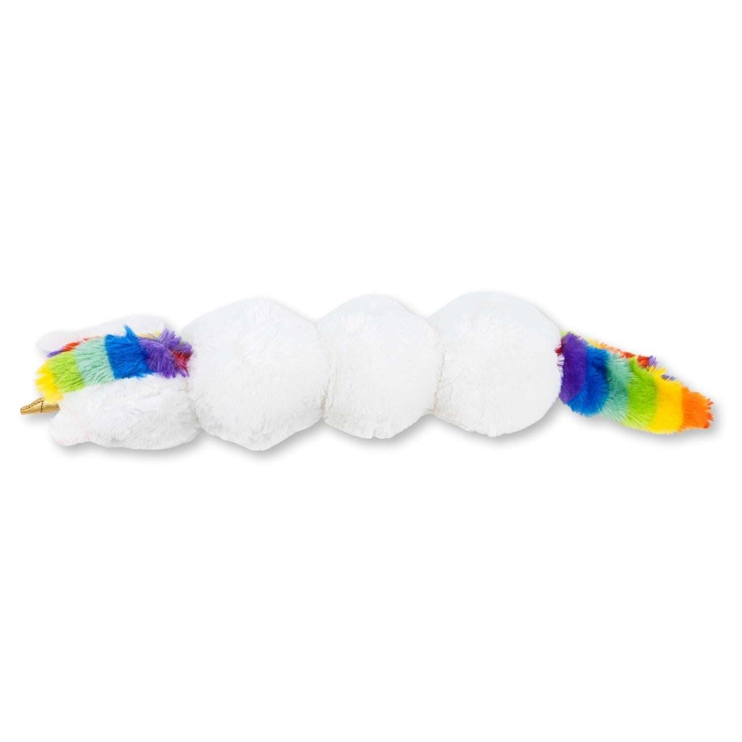 Soft unicorn dog chew toy with colorful rainbow tail, perfect for playful pups