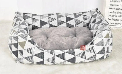 Purrfect Pet Kingdom spill-resistant cat bed with gray cushioned interior and geometric black and white pattern