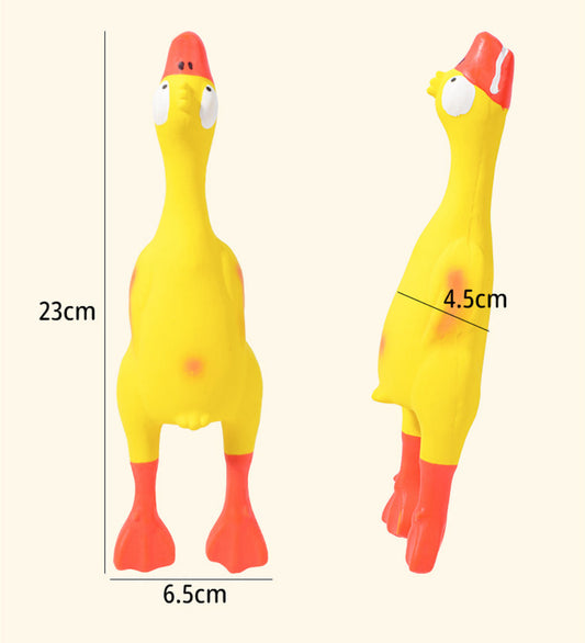 Yellow squeaky dog toy shaped like a rubber chicken with vibrant red accents