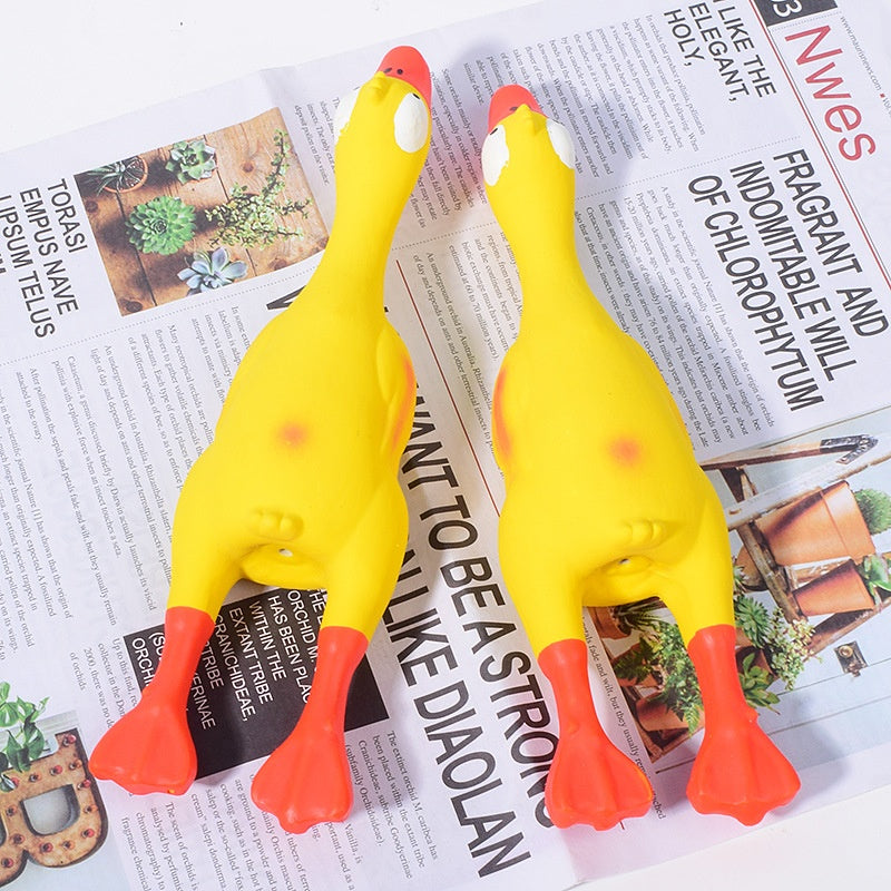 Bright yellow squeaky dog toys shaped like ducks for interactive playtime and fun