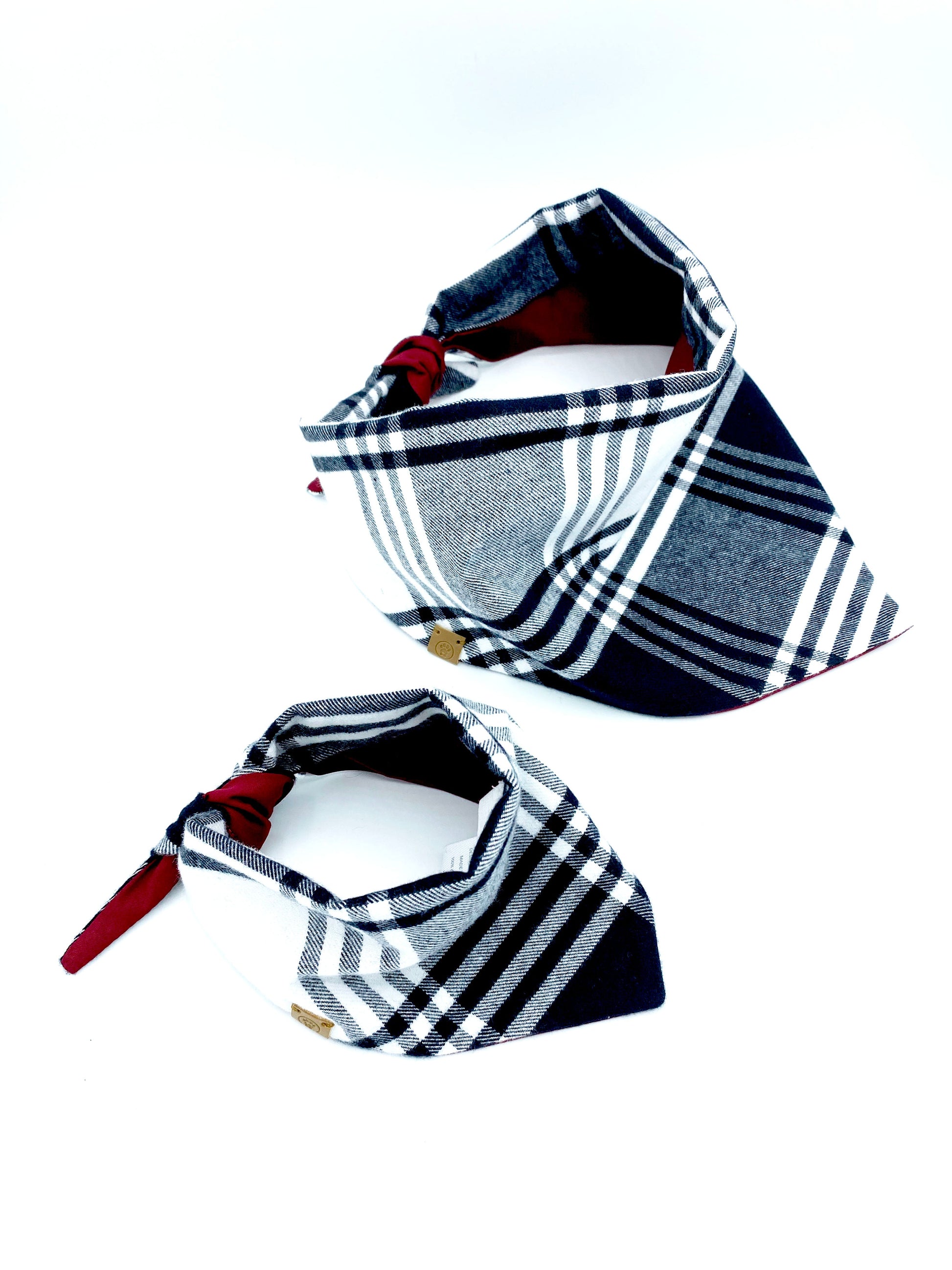Two stylish cat bandanas in a plaid design for fashionable feline accessories