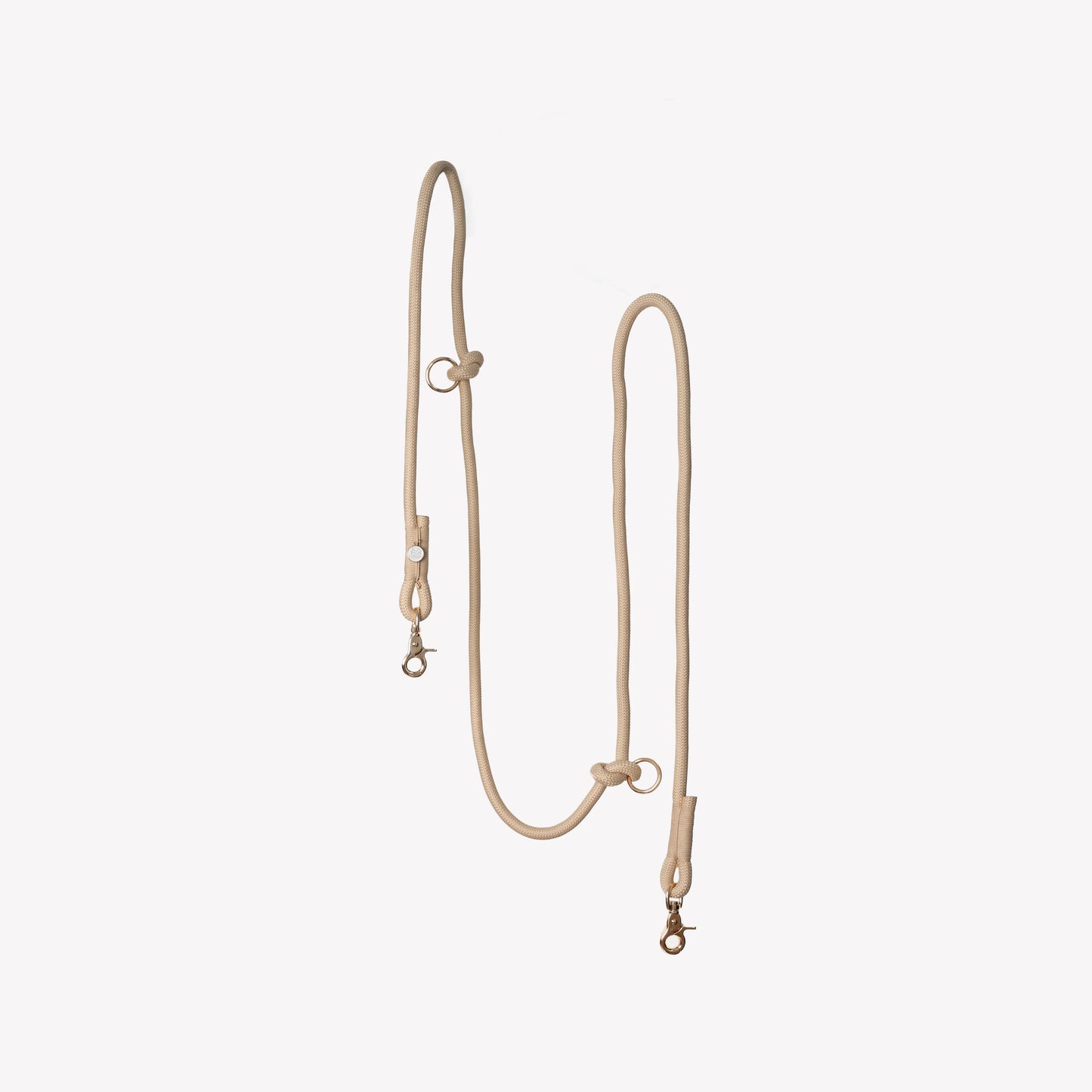 Tan hands-free braided leash by FURLOU, perfect for walking dogs, featuring a durable design and comfortable grip.