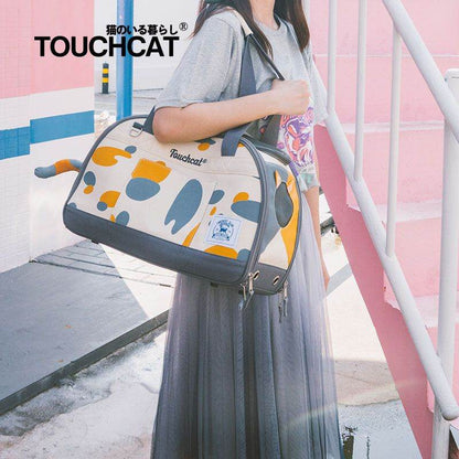 Stylish cat travel bag by Purrfect Pet Kingdom with playful abstract design carried by woman
