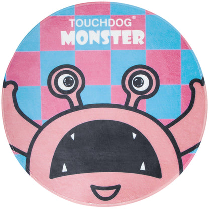 Pet Life plush circular dog bed with a pink monster face and 'Monster' text on a blue/pink checkered top.