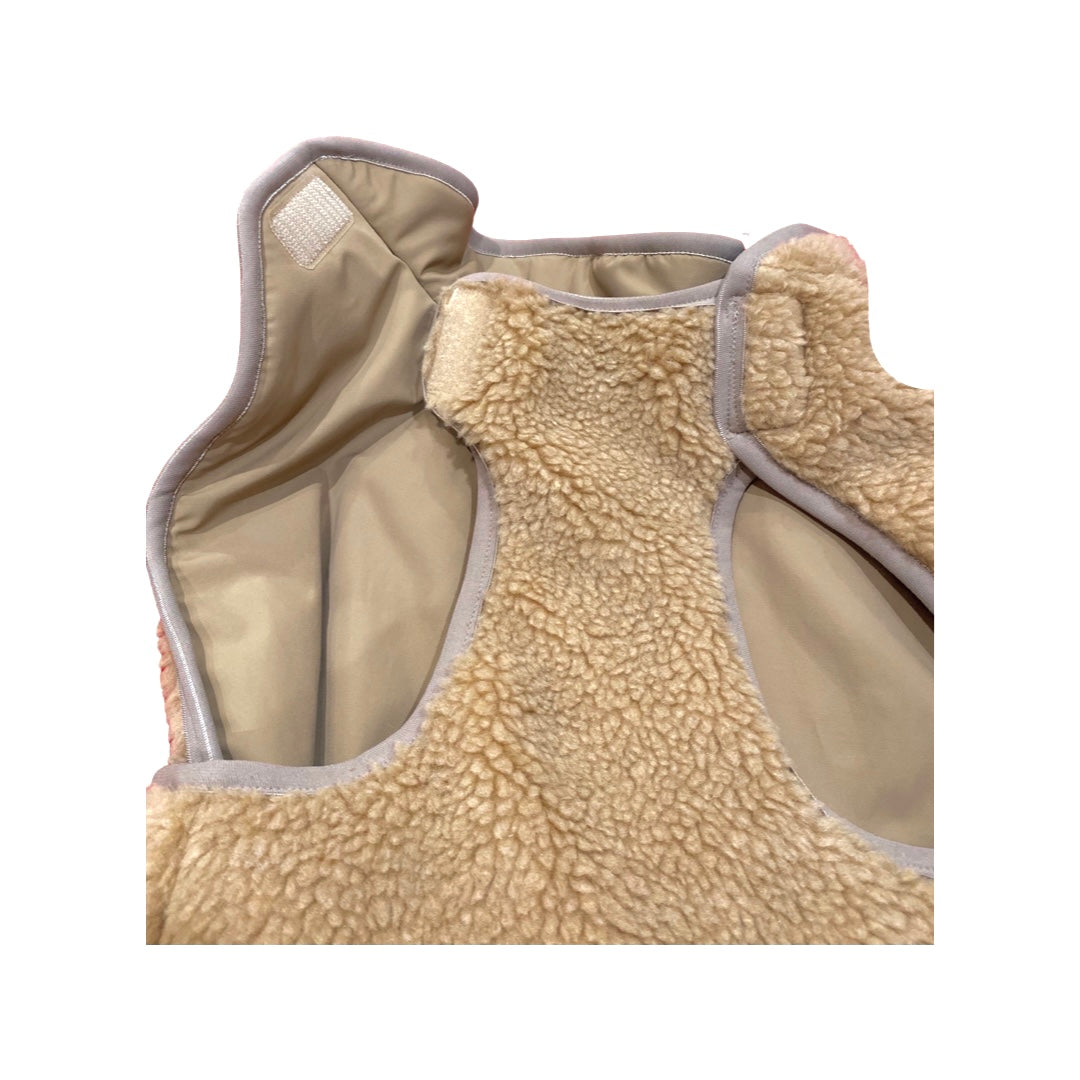 Soft tan lining of a warm dog coat for small dogs, featuring cozy and stylish insulation