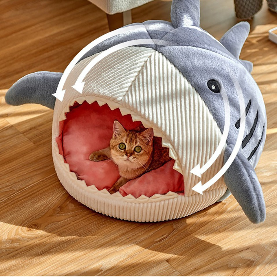 Warm enclosed pet bed for small animals shaped like a shark with soft interior for cozy naps