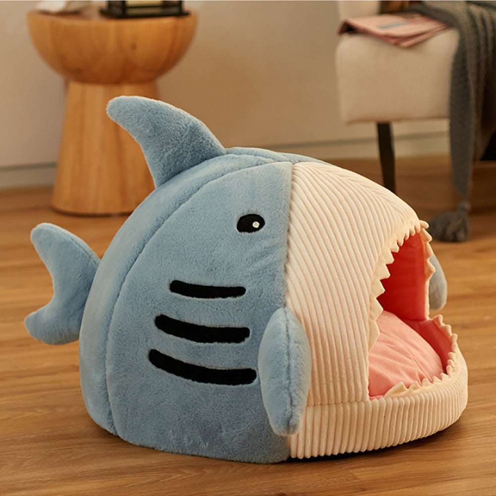 Warm enclosed pet bed for small animals shaped like a shark, providing cozy comfort and security