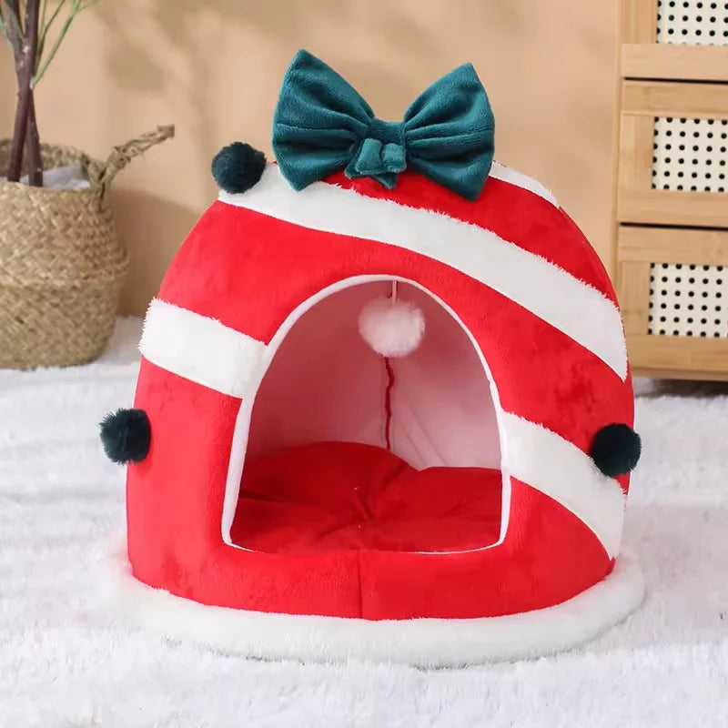 Tail Chasers warm holiday cat house in red and white design with a bow and pom-poms for cozy comfort
