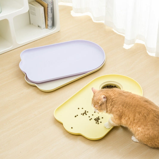 MangoPets waterproof pet feeding mat in two colors with a cat eating from the bowl
