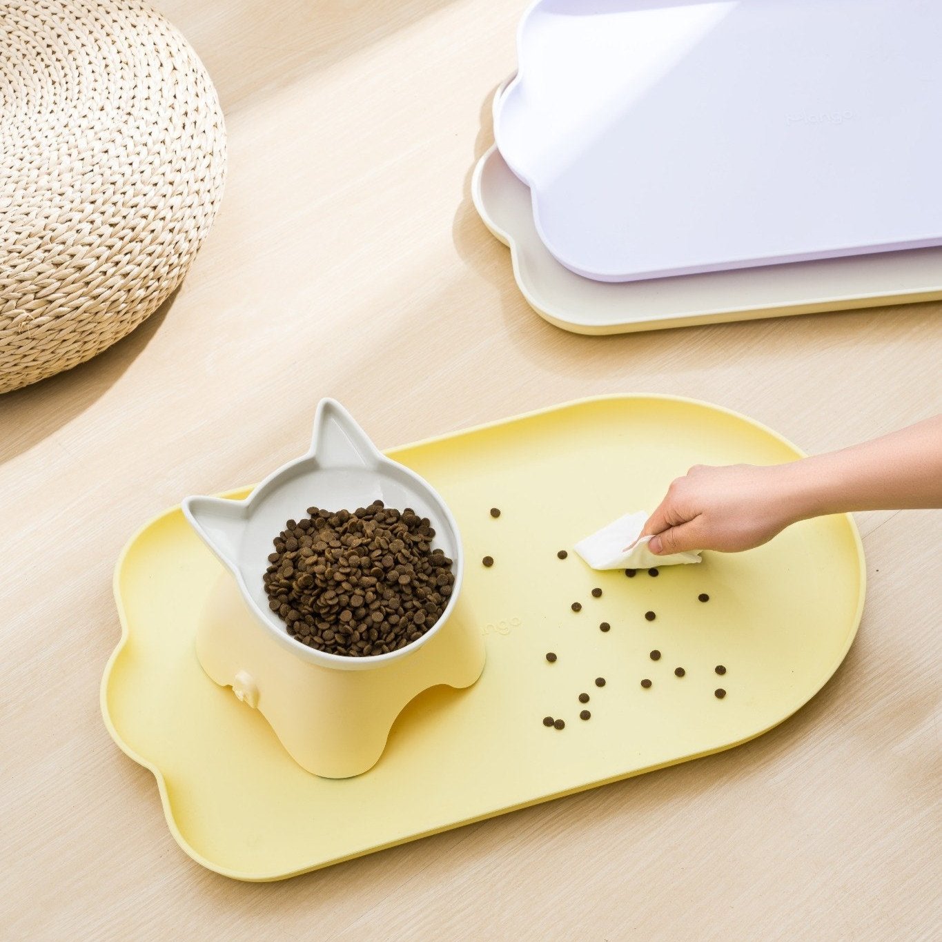 MangoPets waterproof pet feeding mat in yellow with a cat-shaped bowl and easy clean design