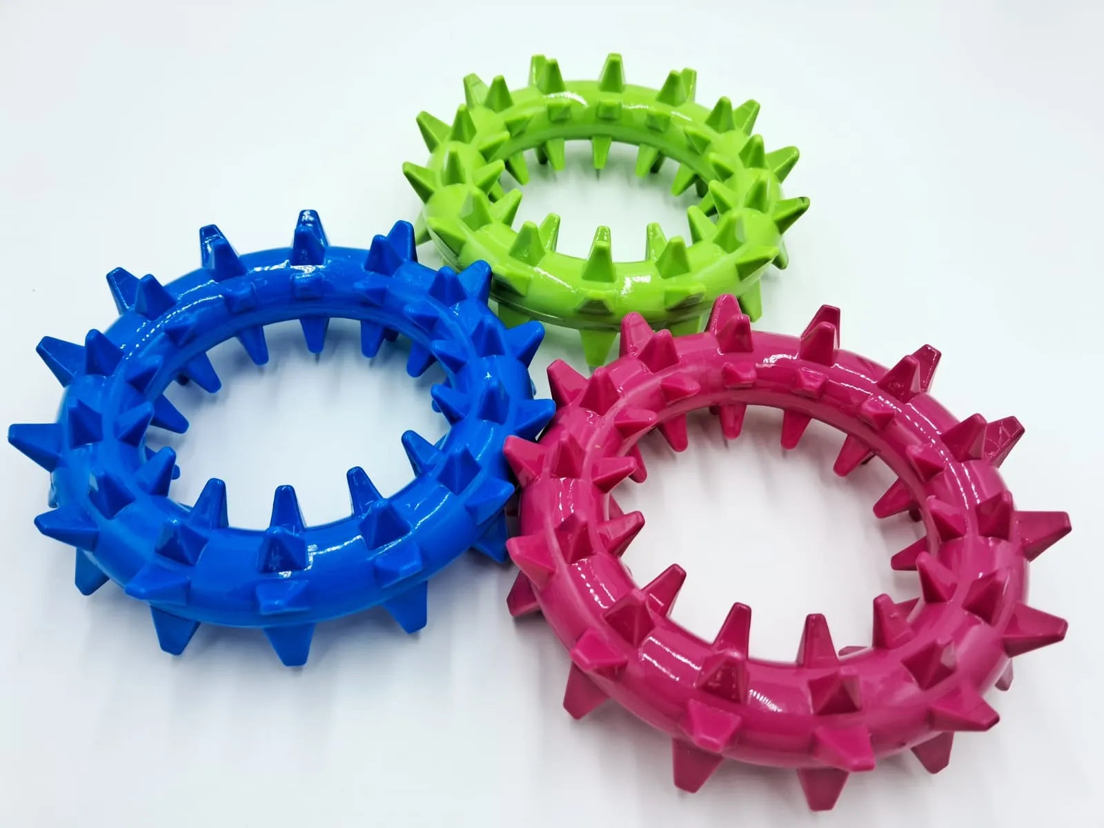 Durable 8in Wheel O' Spikez dog toy by Toys N Treats Box, available in Raspberry Pink, perfect for heavy chewers.