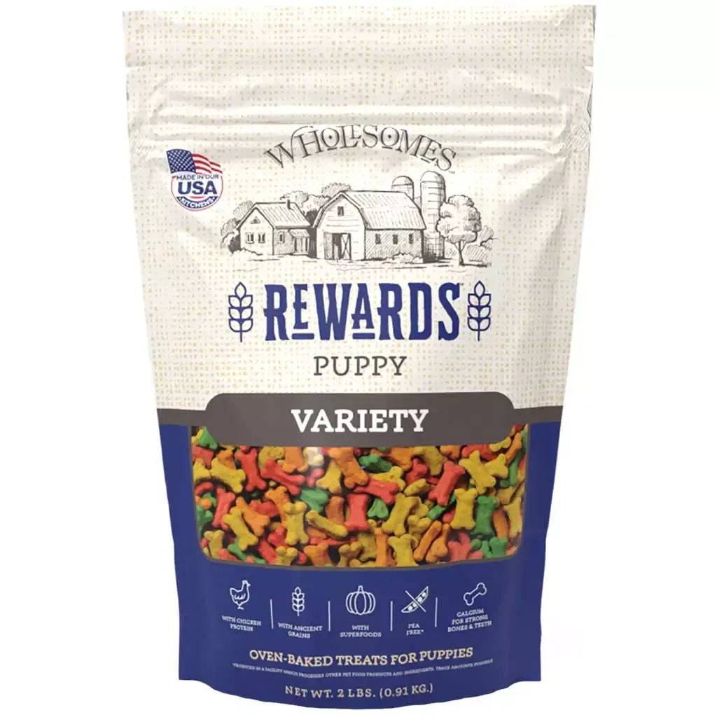 Wholesomes Puppy Variety Dog Treats (2lb) by The Family Pet, featuring colorful packaging, perfect for training and reward...