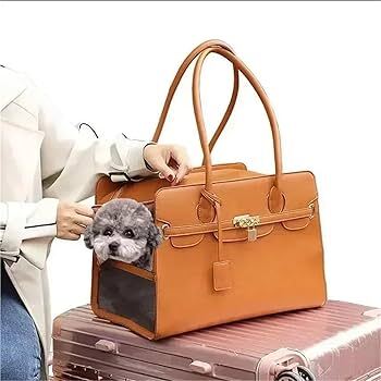 Stylish Tail Chasers leather cat carrier tote with a pet comfortably peeking out for travel