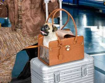 Tail Chasers leather cat carrier tote with a cute dog peeking out, ideal for travel and comfort